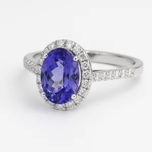 Sužadėtuvių žiedas halo dizaino su ovalo formos tanzanitu centre ir smulkiais deimantais aplinkui